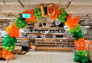 Ballonbogen in Orange und Grüntönen