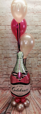 Pinke Sektflasche mit Ballons