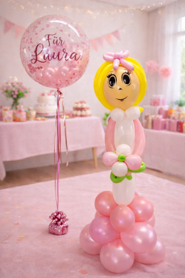 Mädchen in Rosa mit Konfettiballon