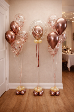 Dekoration in Rosengold und Weiß mit Konfettiballons